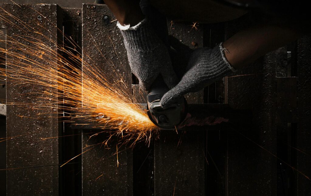 Australian tradesman using a power saw on a construction worksite